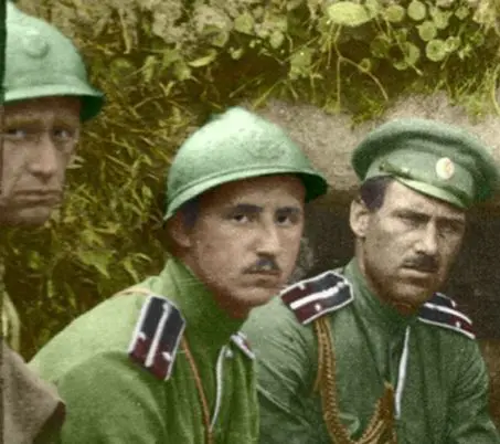 A group of men in green uniforms and hats.