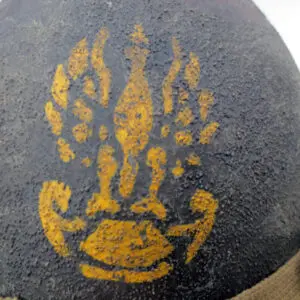 A close up of the yellow hand print on a rock.