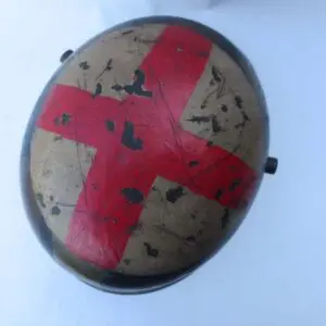 A helmet with a cross painted on it.