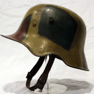 A helmet with a leather strap on top of it.
