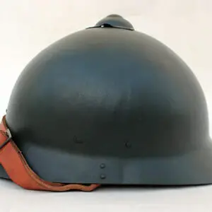 A black helmet with orange strap on top of it.