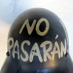 A close up of the top of a helmet with graffiti