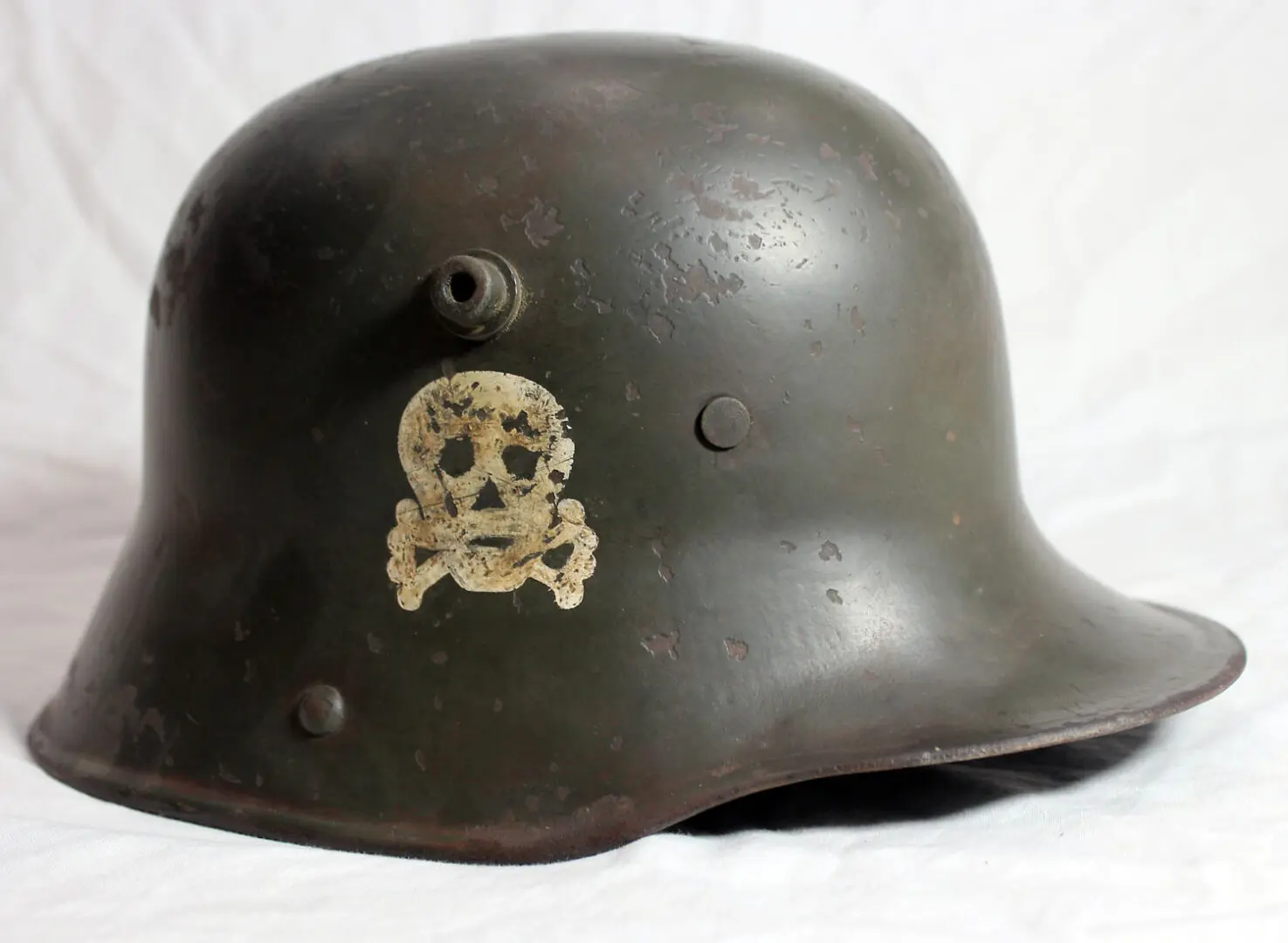 A helmet with a skull and crossbones on it.
