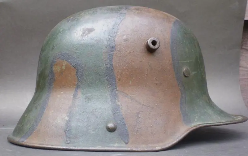 A close up of the side of an old helmet