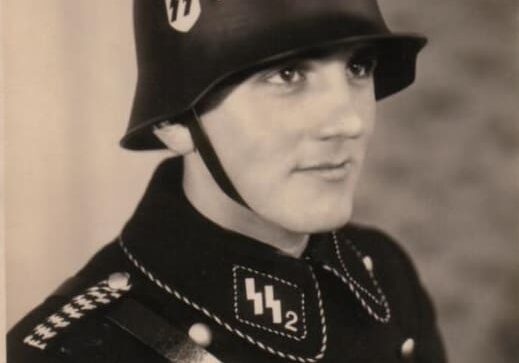 A man in uniform with a helmet and sword.