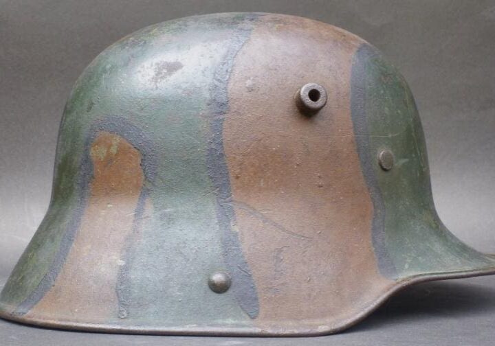 A close up of the side of an old helmet